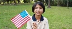 child holding american flag